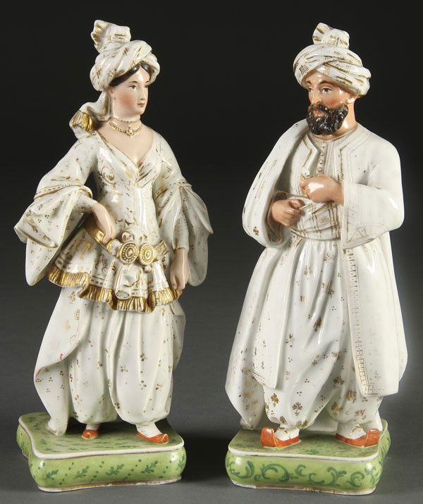 PR OF FRENCH OLD PARIS PERFUME BOTTLES: A PAIR OF FRENCH OLD PARIS FIGURAL PERFUME BOTTLES, early 19th century, probably by Jacob Petit, of an Arab man and woman. Height 11.5 inches.