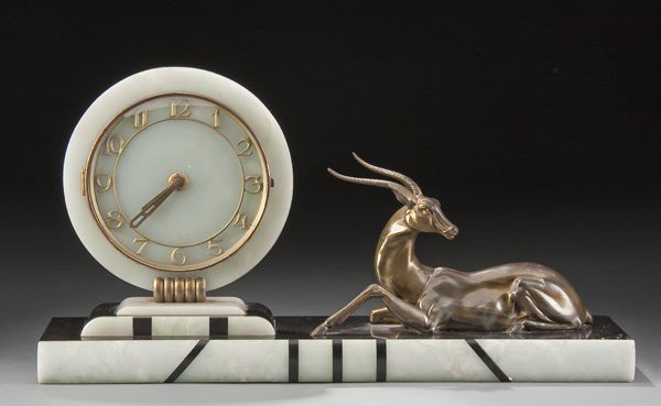 FRENCH ART DECO MANTLE CLOCK: A LARGE & IMPRESSIVE FRENCH ART DECO MANTLE CLOCK with an ormolu figure of a gazelle on an onyx inlaid base. Length 22 inches.