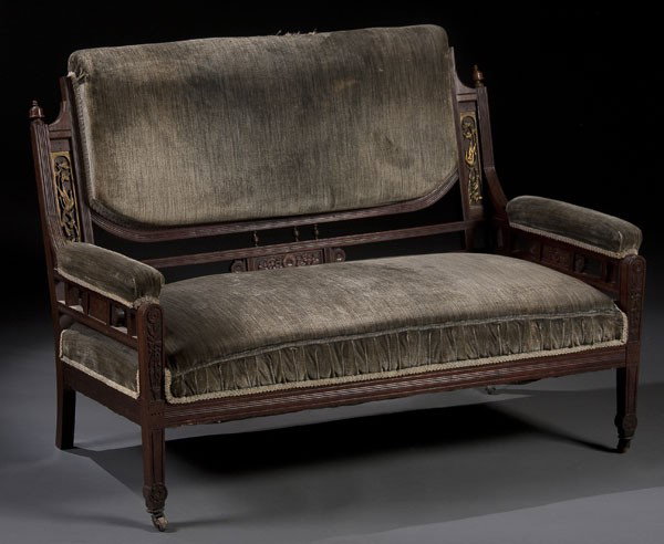 VICTORIAN CARVED WALNUT PARLOR SET: A VICTORIAN CARVED WALNUT & ORMOLU MOUNTED PARLOR SET circa 1875. Consisting of a settee and 4 matching upholstered armchairs, each with carved floral panels and recessed embossed ormolu gilt panels o