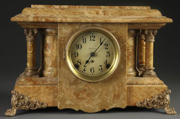 SETH THOMAS VICTORIAN MANTLE CLOCK: A SETH THOMAS VICTORIAN MANTLE CLOCK circa 1900. In a marbelized case with four columns and ormolu mounts. Length 17.5 inches.