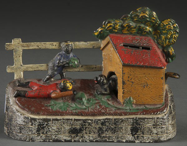 BOY STEALING WATERMELON MECHANICAL BANK: BOY STEALING WATERMELON MECHANICAL BANK circa 1885, Kyser and Rex, excellent condition with nice paint, replaced arm. Length 6.5 inches.