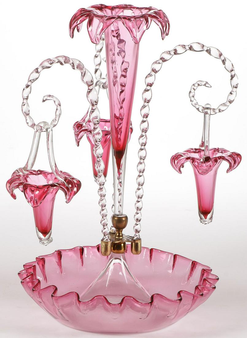 BEAUTIFUL VICTORIAN CRANBERRY TRUMPET EPERGNE: BEAUTIFUL VICTORIAN CRANBERRY TRUMPET EPERGNE. With center trumpet vase and three clear twist glass brackets supporting three lily head baskets beneath a ruffled rim with conical base. Height 15 inche