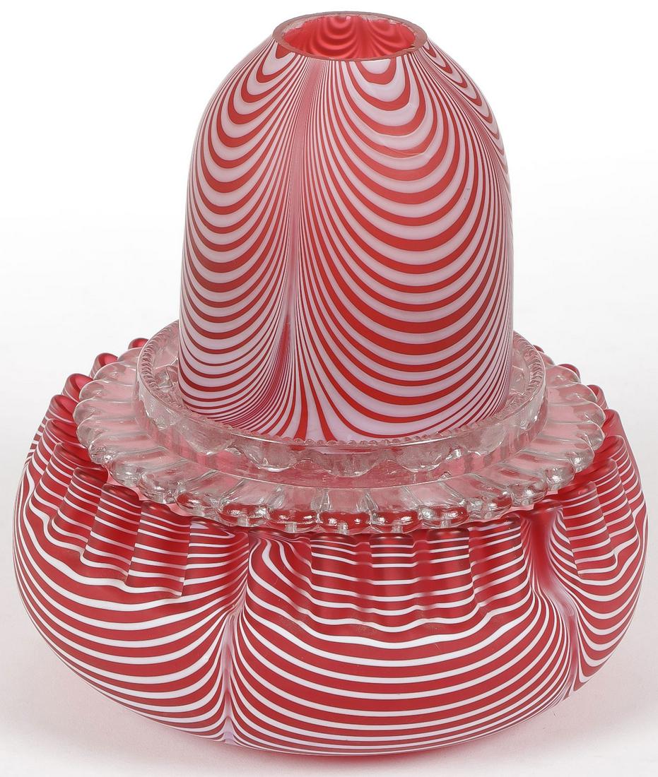 CRANBERRY OPAL FAIRY LAMP: CRANBERRY OPAL FAIRY LAMP. In Nailsea design with clear glass insert. Height 6 inches. SHIPPING NOTICE: Jackson's is your sole and only source for one stop packing and shipping. With over 50 years of