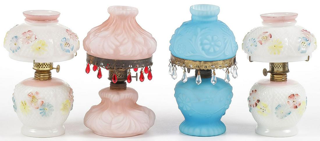 FOUR VINTAGE MINIATURE KEROSENE LAMPS: FOUR VINTAGE MINIATURE KEROSENE LAMPS. Comprising two Consolidated Cosmos lamps, two in satin finish, including one in drape pattern, the other in daisy and fern, each with matching base and shade. Gr