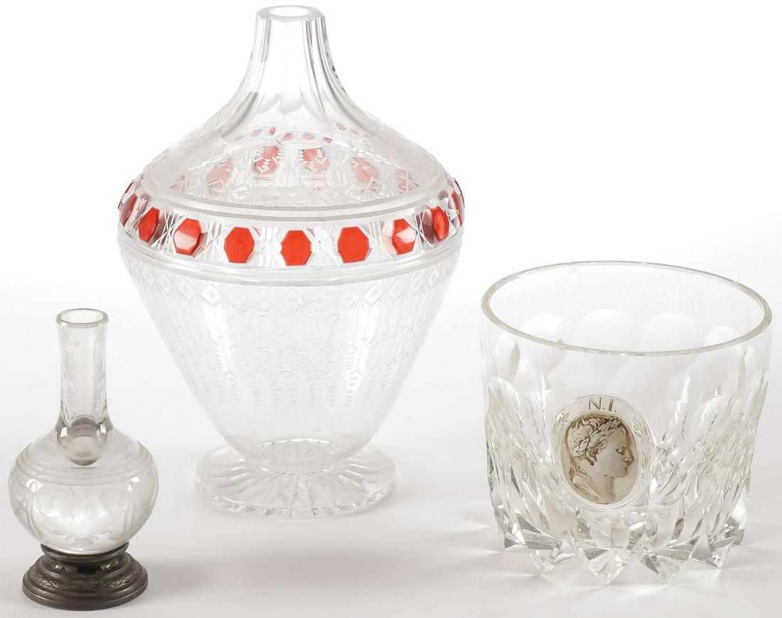 EARLY CONTINENTAL GLASS GROUP C. 1800-1850: EARLY CONTINENTAL GLASS GROUP C. 1800-1850. Comprising a small bottle form crystal vase with etched decoration on sterling base, an interesting ruby flashed and etched baluster form vase and a crystal
