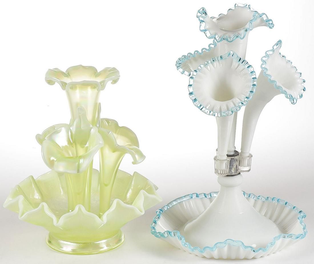 TWO FENTON GLASS EPERGNES: TWO FENTON GLASS EPERGNES. Comprising an iridescent finished example with ruffled rim, center trumpet vase surrounded by three Jack in the Pulpit inserts and original Fenton sticker. Together with a F