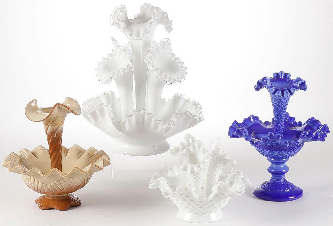 FOUR FENTON ART GLASS EPERGNES: FOUR FENTON ART GLASS EPERGNES. Of various colors and designs. Greatest height 13 inches.SHIPPING NOTICE:Jackson's is your sole and only source for one stop packing and shipping. With over 50 years