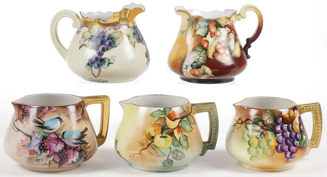 FIVE HAND-PAINTED CIDER PITCHERS C. 1910: FIVE HAND-PAINTED CIDER PITCHERS C. 1910. Of various shapes and forms all but one with artist signature and one with charming painting of song birds amongst berry bush. Four with French maker's marks,