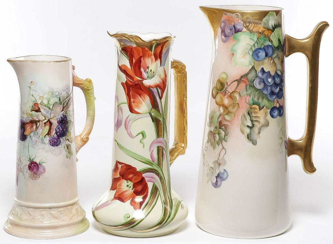 THREE FINE BELLEEK HP TANKARDS: THREE FINE BELLEEK HP TANKARDS. From left to right a finely decorated tankard in mulberry motif on a Belleek Willets blank, the second a studio decorated piece depicting tulips on a luster ground with