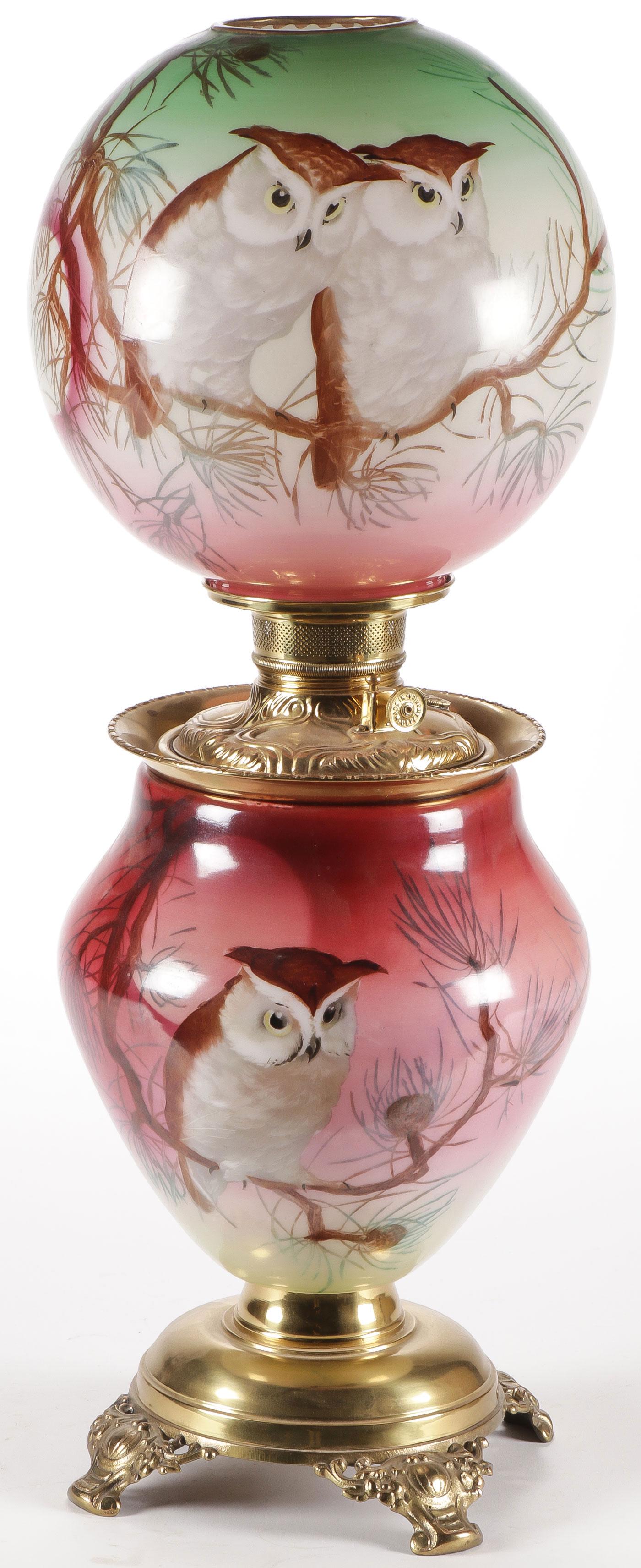 RARE OWL DECORATED GWTW PARLOR LAMP: RARE OWL DECORATED GWTW PARLOR LAMP. Comprising an attractive finely decorated lamp depicting owls perched in pine trees, not electrified. Height 25.5 inches. SHIPPING NOTICE: Jackson's is your sole a