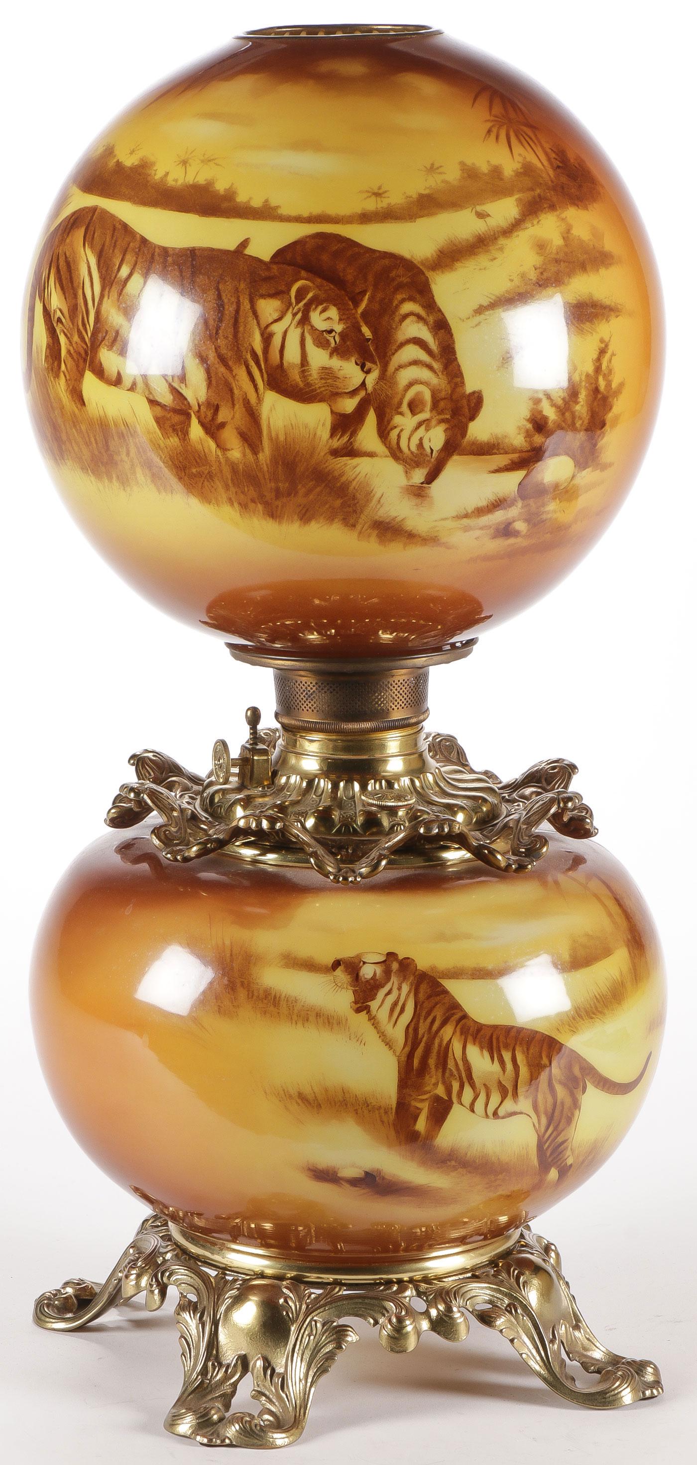 RARE DOUBLE GLOBE TIGER GWTW PARLOR LAMP: RARE DOUBLE GLOBE TIGER GWTW PARLOR LAMP. Both the base and globe similarly decorated with tigers in palm tree lined landscape. With Consolidated font and burner. Height 23.5 inches. SHIPPING NOTICE: