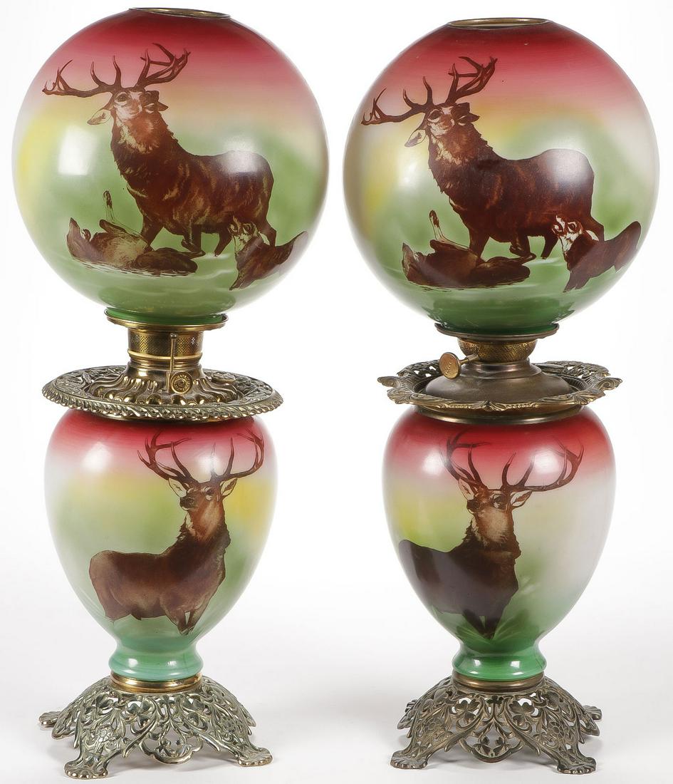 GREAT PR OF STAG GONE WITH THE WIND PARLOR LAMPS: GREAT PR OF STAG GONE WITH THE WIND PARLOR LAMPS. Comprising a matching pair, the base and globe each decorated with giant stags and with original oil font and burners, not electrified. Height 26.5 in