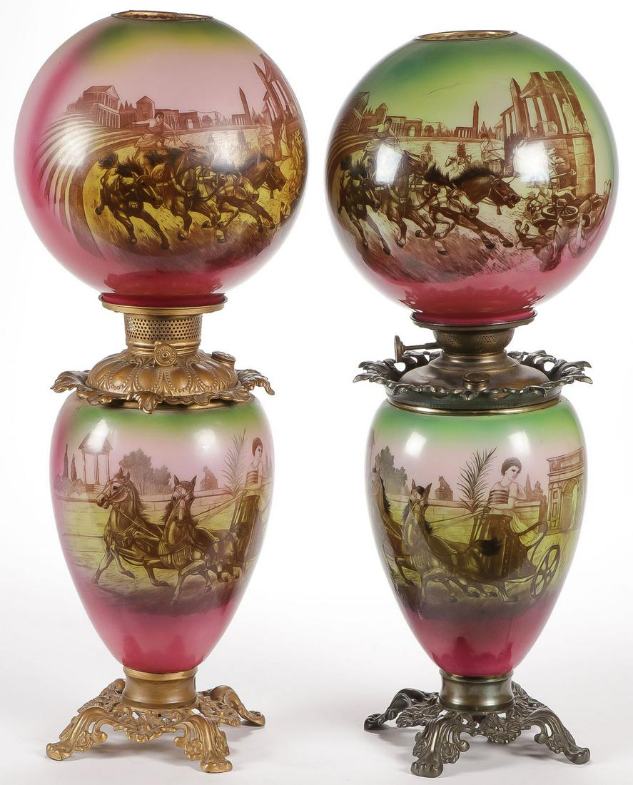 PAIR MATCHING GONE WITH THE WIND PARLOR LAMPS: PAIR MATCHING GONE WITH THE WIND PARLOR LAMPS, C. 1910. Comprising a pair of matching electrified parlor lamps, the globes and bases with chariot scenes. Height 25 inches.SHIPPING NOTICE:Jackson's i