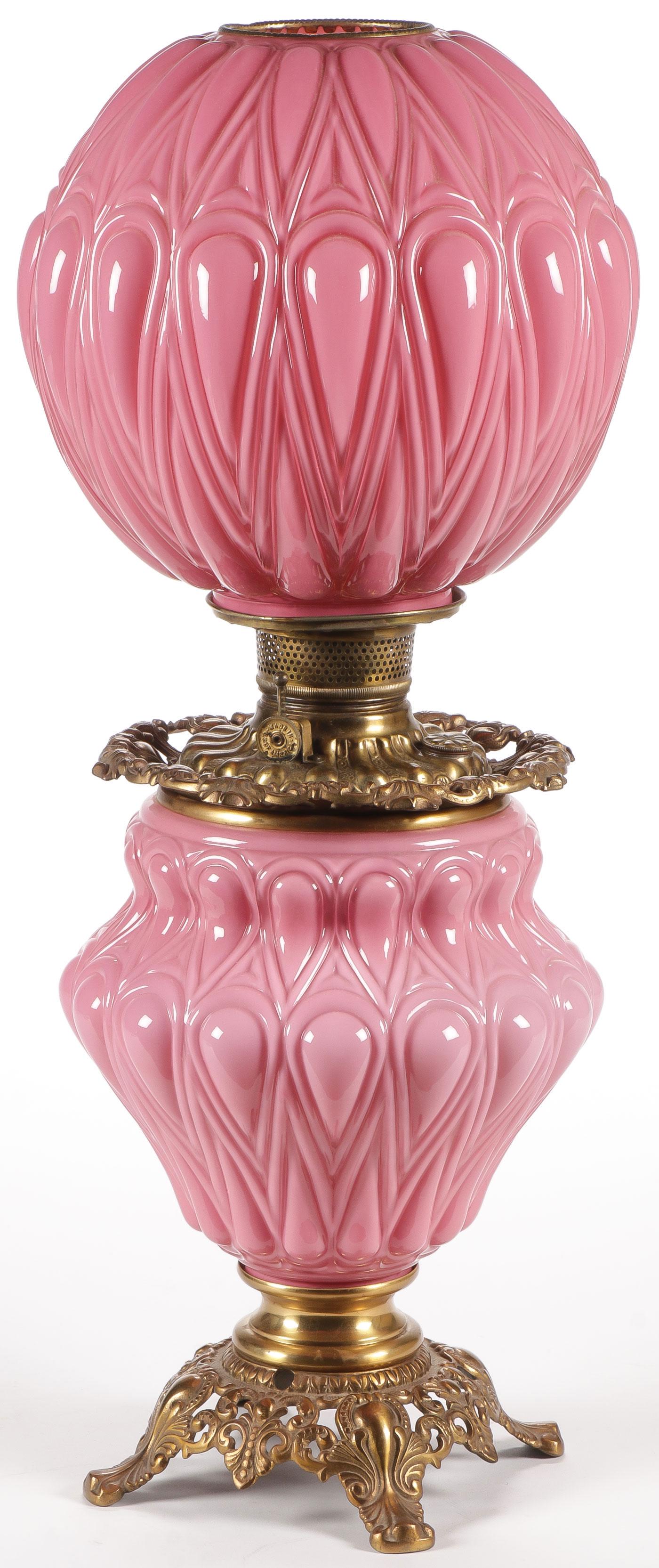 SPECTACULAR PINK CASE GLASS GWTW PARLOR LAMP: SPECTACULAR PINK CASE GLASS GWTW PARLOR LAMP. The base and globe in blown out Puritan pattern cased glass with original oil font and burner, not electrified. Probably Consolidated. Height 25.25 inches