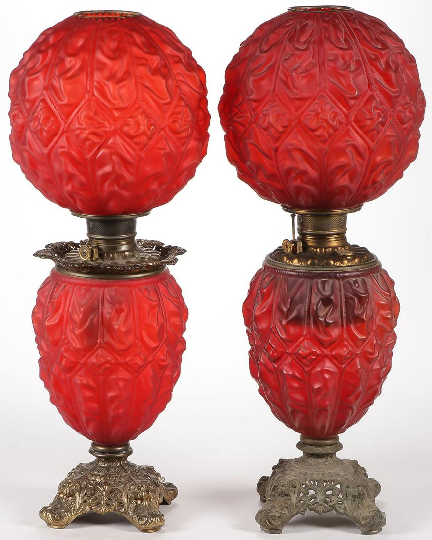 PAIR CONSOLIDATED PARLOR LAMPS: PAIR CONSOLIDATED PARLOR LAMPS. Each in red satin glass finish in the Imperial Diamond Drape pattern, one electrified. Height 27 inches each. SHIPPING NOTICE: Jackson's is your sole and only source fo