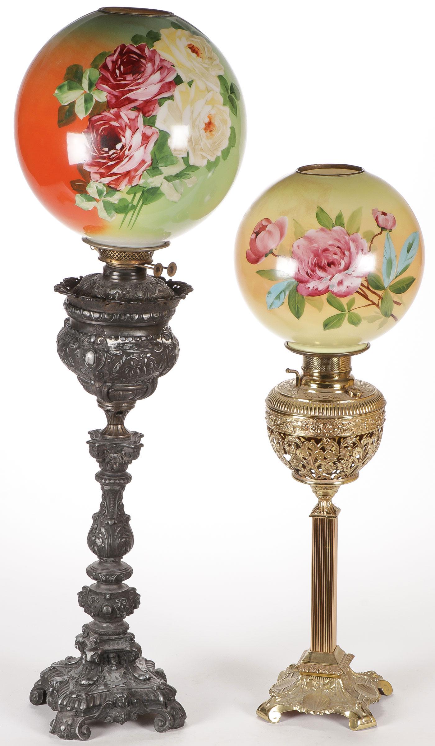 PAIR VICTORIAN BANQUET LAMPS 19TH C: PAIR VICTORIAN BANQUET LAMPS 19TH C. Comprising a pair of large and impressive banquet lamps, the largest with cast metal baluster form base decorated with faces and rocaille scrolls, with original do