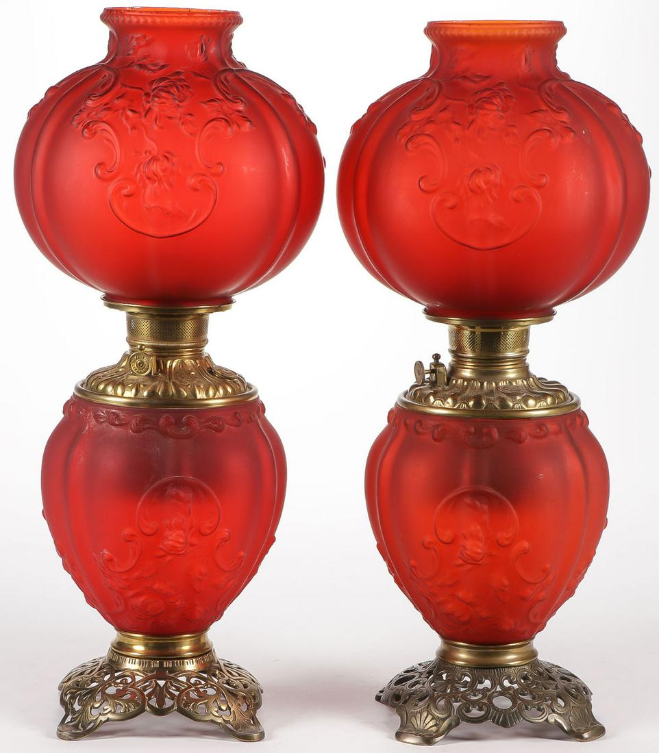 PAIR OF FOSTORIA PARLOR LAMPS: PAIR OF FOSTORIA PARLOR LAMPS. Both in red satin Gardenia pattern, each 23 inches. SHIPPING NOTICE: Jackson's is your sole and only source for one stop packing and shipping. With over 50 years of expe