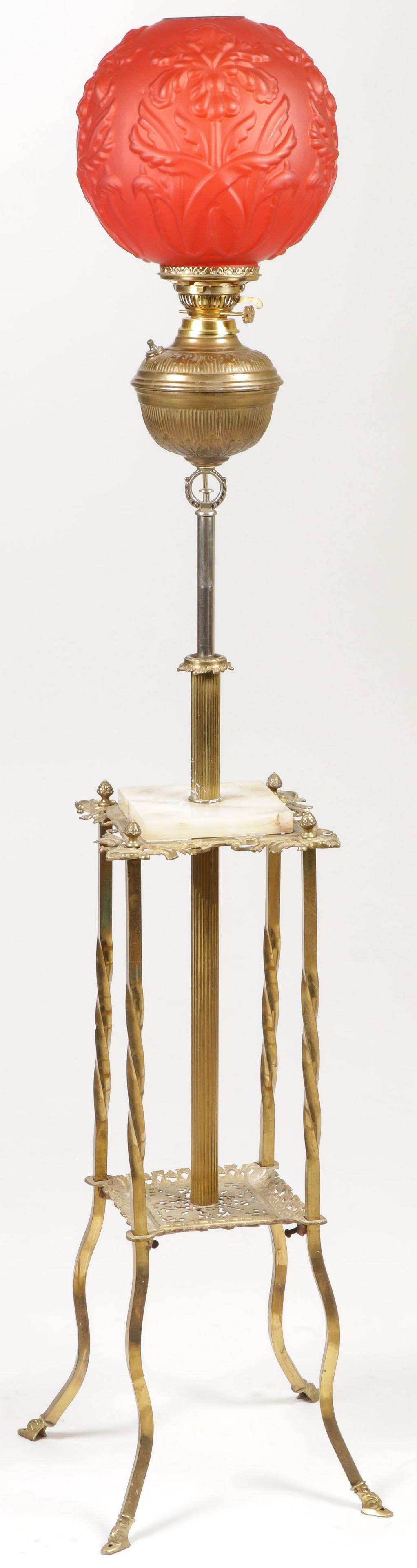 FANCY VICTORIAN ORGAN LAMP: FANCY VICTORIAN ORGAN LAMP. Of square form, with twist column legs, onyx platform beneath adjustable font, set with red satin glass blown out shade decorated with iris. Electrified. SHIPPING NOTICE: J