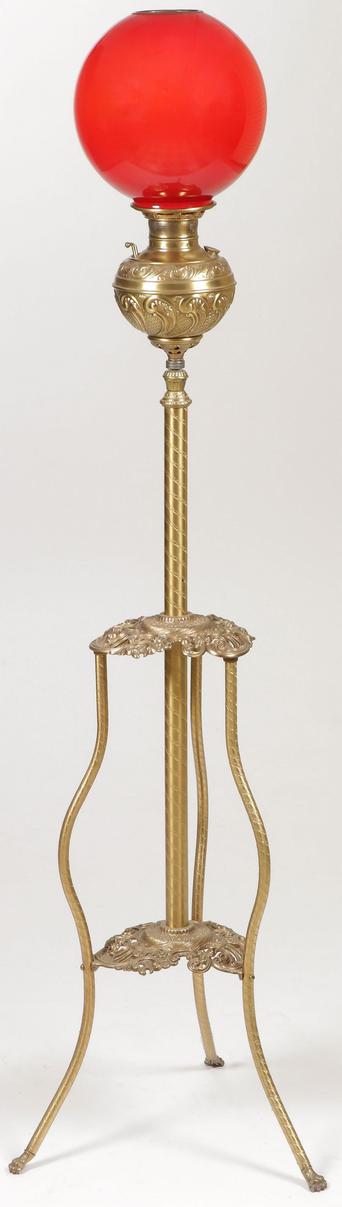 ORNATE VICTORIAN ORGAN LAMP: ORNATE VICTORIAN ORGAN LAMP. With adjustable base, red cased glass globe, not electrified. SHIPPING NOTICE: Jackson's is your sole and only source for one stop packing and shipping. With over 50 years