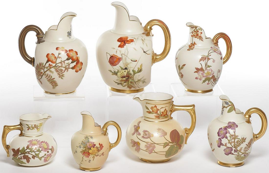 SEVEN ROYAL WORCESTER PITCHERS: SEVEN ROYAL WORCESTER PITCHERS. Beautifully floral decorated with gilt highlights, various shapes and sizes as shown. Greatest height 7 inches. SHIPPING NOTICE: Jackson's is your sole and only source