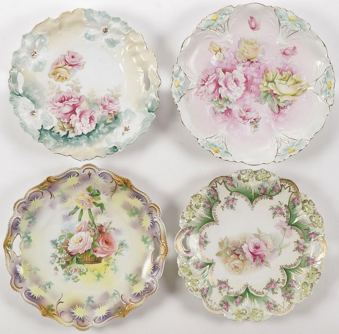 FOUR R.S. PRUSSIA HANDLED TRAYS: FOUR R.S. PRUSSIA HANDLED TRAYS. Each floral decorated and all but one with Red Star mark. Greatest diameter 10.5 inches. SHIPPING NOTICE: Jackson's is your sole and only source for one stop packing a