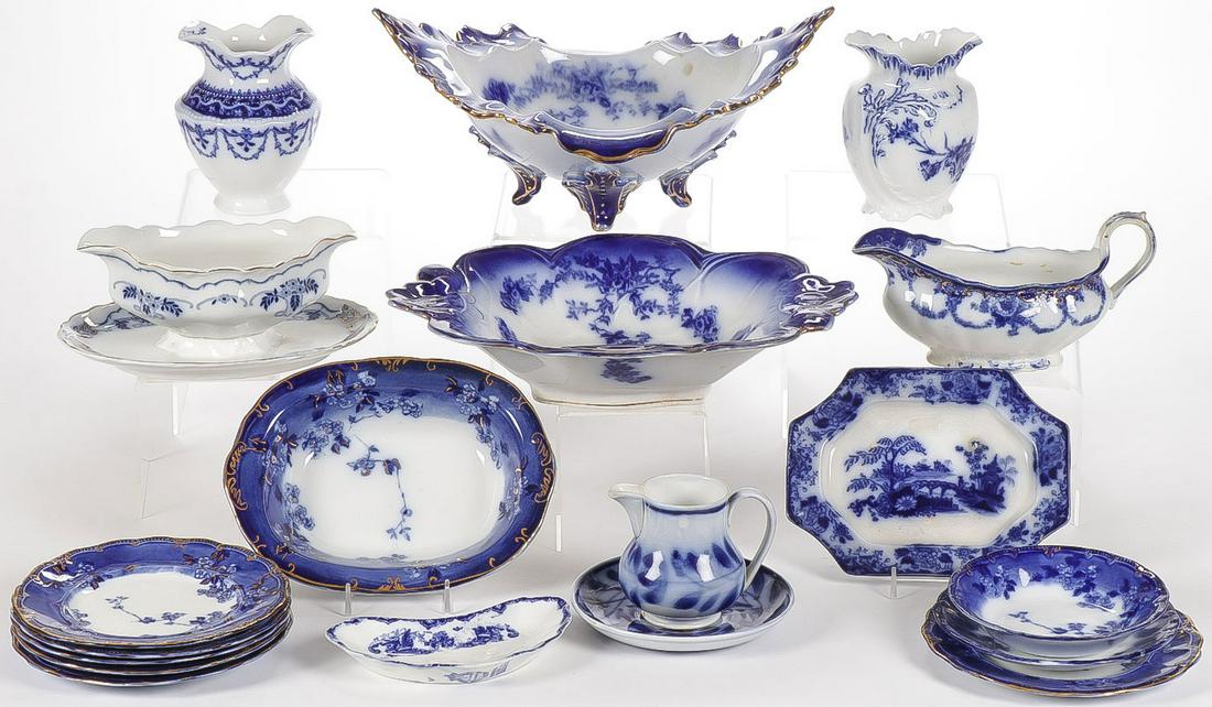 19-PIECES FLOW BLUE DINNER WARE: 19-PIECES FLOW BLUE DINNER WARE. Comprising a variety of pieces including plates and serving wares, including a fancy gilt embellished La Belle China footed centerpiece and scalloped bowl, as well as 