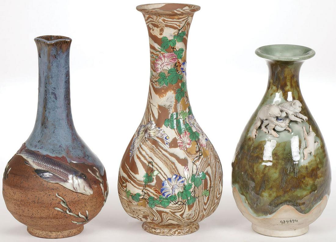 JAPANESE GLAZED CERAMIC VASES, LATE MEIJI: JAPANESE GLAZED CERAMIC VASES, LATE MEIJI. Comprising three studio ceramic vessels including a marbleized bulbous form vase with enameled flower and butterfly decoration, a drip glazed vase with appli