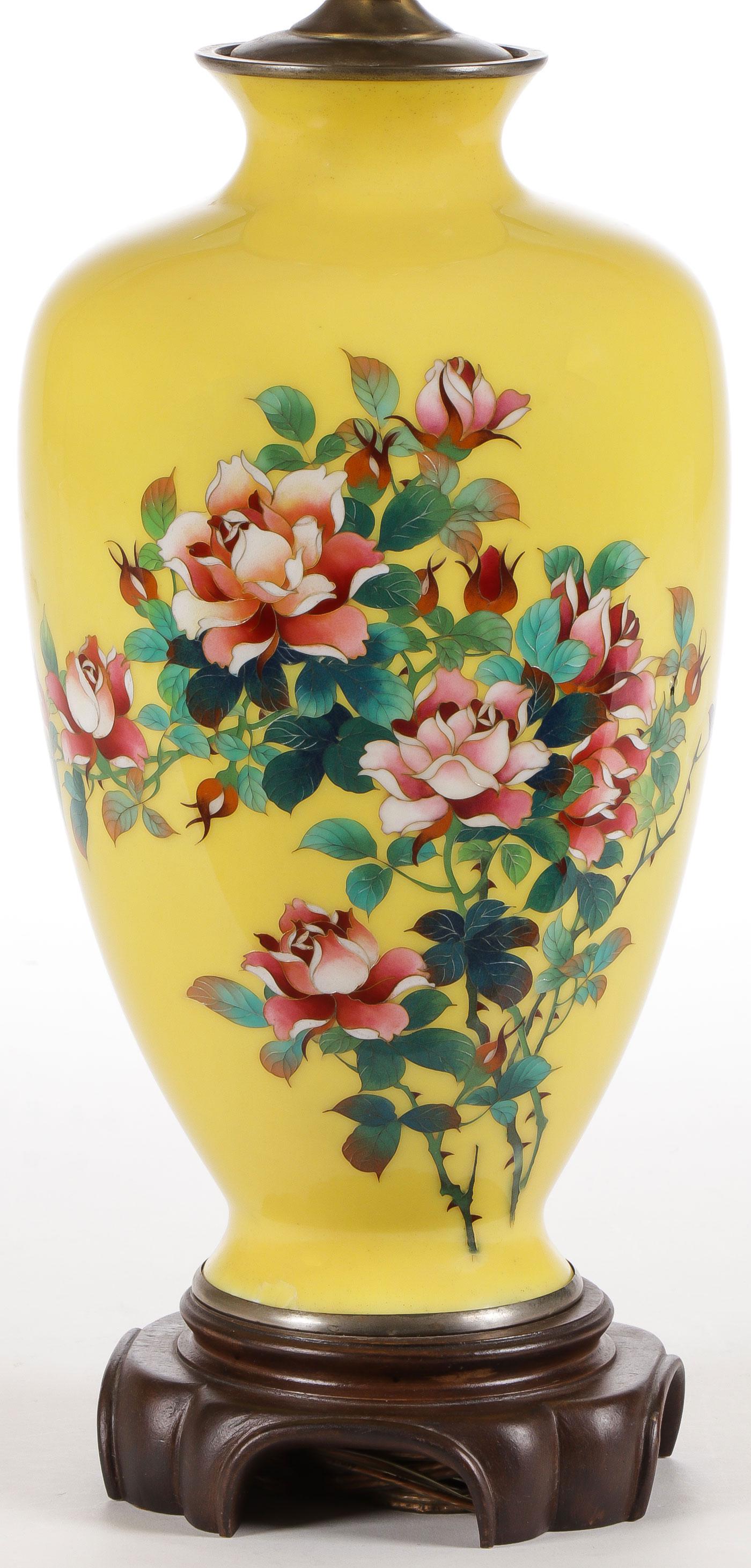 A JAPANESE CLOISONNÉ VASE: A JAPANESE CLOISONNÉ VASE. Finely enameled with roses on a yellow ground, converted into lamp. The vase 12 inches. SHIPPING NOTICE: Jackson's is your sole and only source for one stop packing and