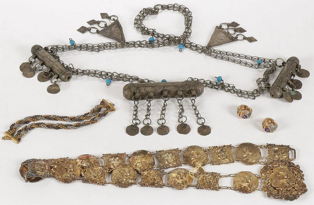 MIXED VINTAGE DECORATIVE ARTS GROUP: MIXED VINTAGE DECORATIVE ARTS GROUP. Including a tribal, probably North African, women's necklace, an Art Deco style gilded belt with spurious hallmarks, a Victorian metal beaded bracelet, and a pair 
