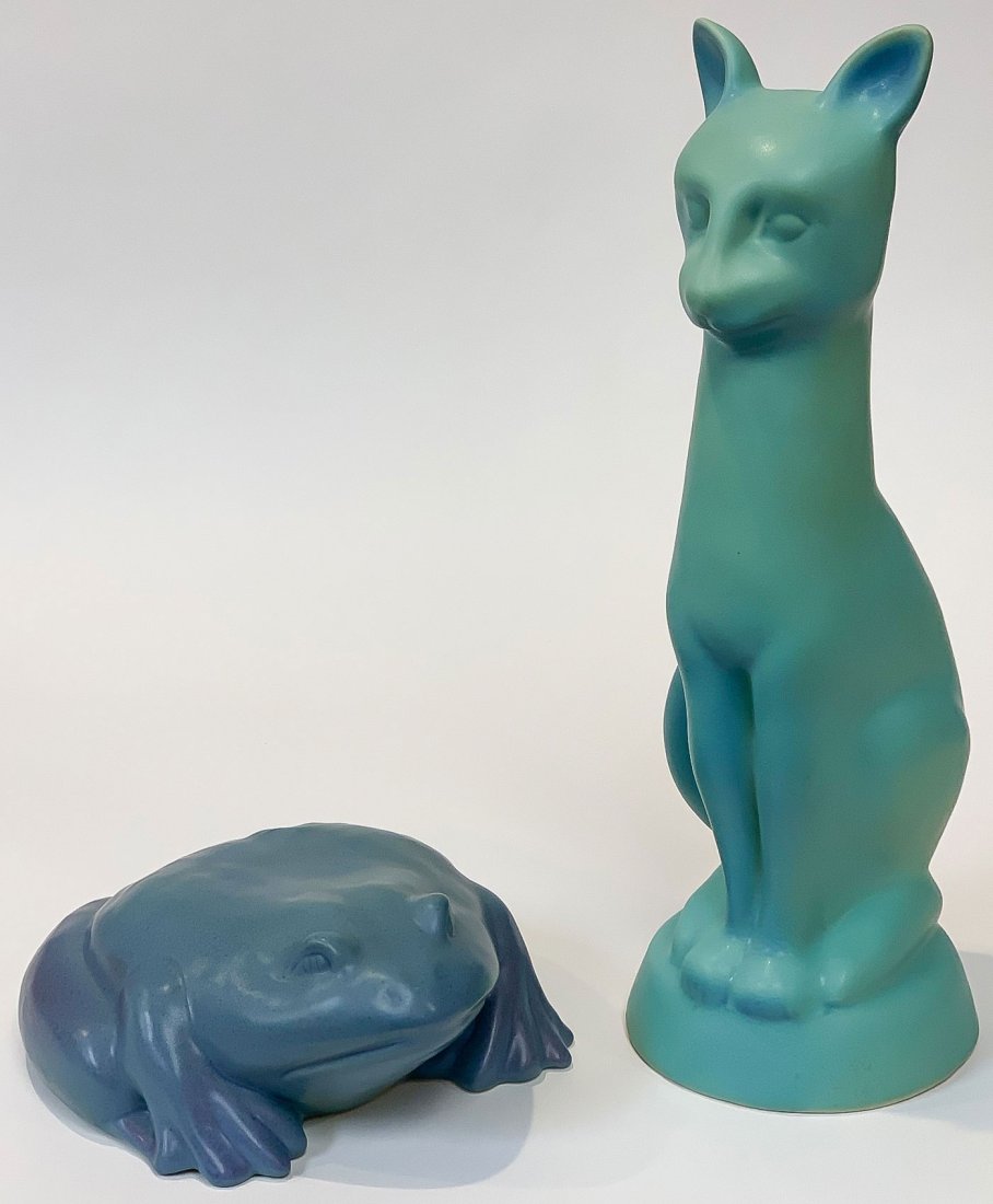 LARGE VAN BRIGGLE ART POTTERY FROG & CAT FIGURES: LARGE VAN BRIGGLE ART POTTERY FROG & CAT FIGURES. Comprising a large frog figure in blue mat glaze, length 9 inches, and a large cat figure in mat turquoise, height 15 inches, underside of each incise