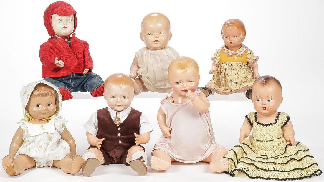 GROUP 7 VINTAGE/ANTIQUE BABY DOLLS: GROUP 7 VINTAGE/ANTIQUE BABY DOLLS. Comprising 7 dolls including an 11-inch four piece jointed composition baby doll with painted features, open mouth with painted red lips and two painted white teeth