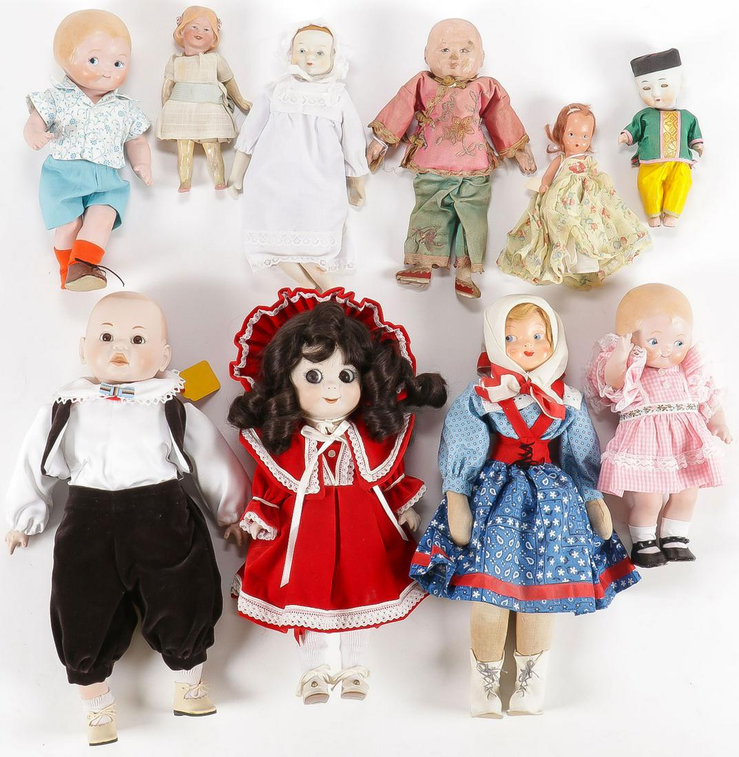 GROUP LOT VINTAGE DOLLS & MORE: GROUP LOT VINTAGE DOLLS & MORE. Comprising 10 individual dolls including an antique German bisque character doll and an antique papier mÃ¢chÃ© oriental doll in traditional costume, greatest measur