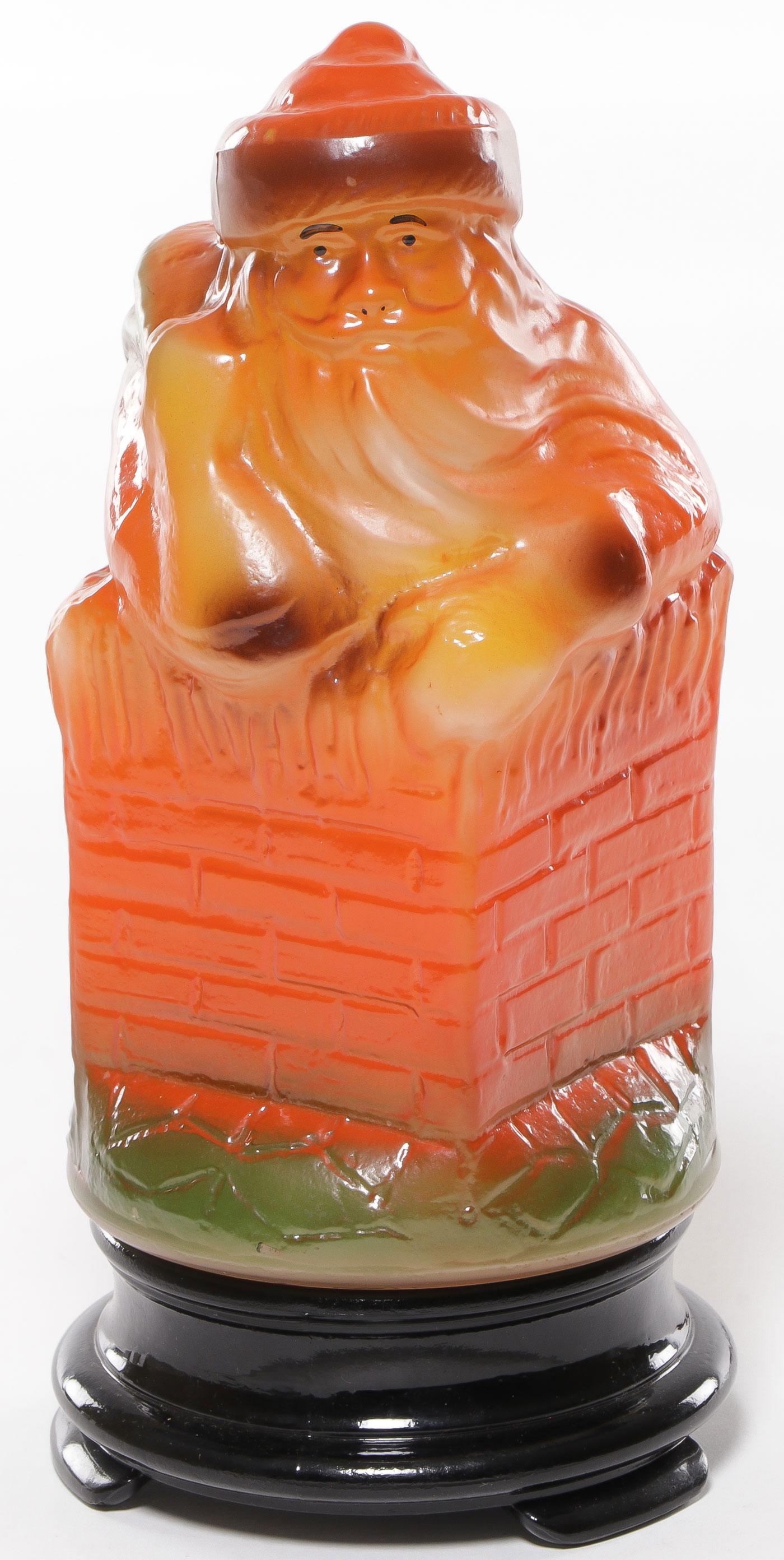 RARE GLASS SANTA LAMP: RARE GLASS SANTA LAMP. Comprising a scarce Santa lamp with threaded, molded and painted Santa shade depicting Santa going down the chimney and including original footed glass base. SHIPPING NOTICE: Ja