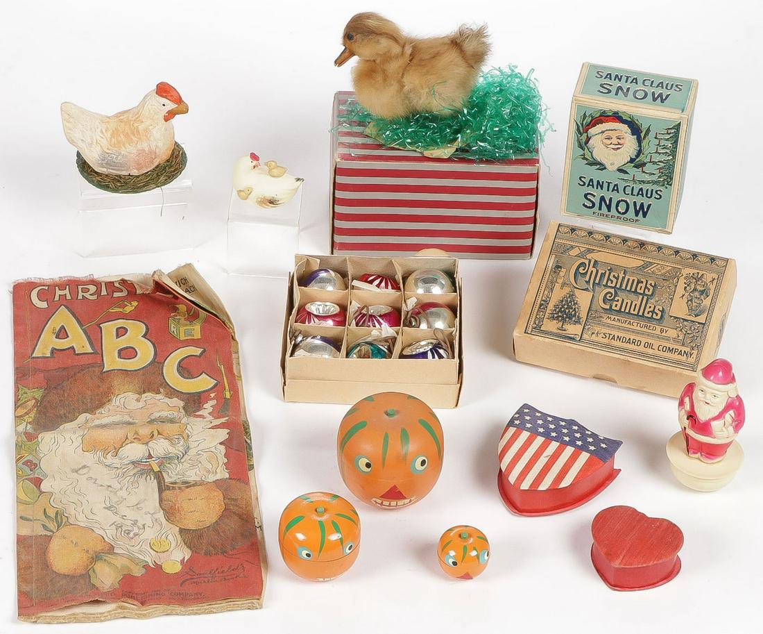 VINTAGE HOLIDAY DECORATIONS C. 1890-1950: VINTAGE HOLIDAY DECORATIONS C. 1890-1950. Comprising a hen on nest candy container, a mint in the box duckling, a box of Mica Manufacturing Company Santa Snow in the original box unused, a box of Stan