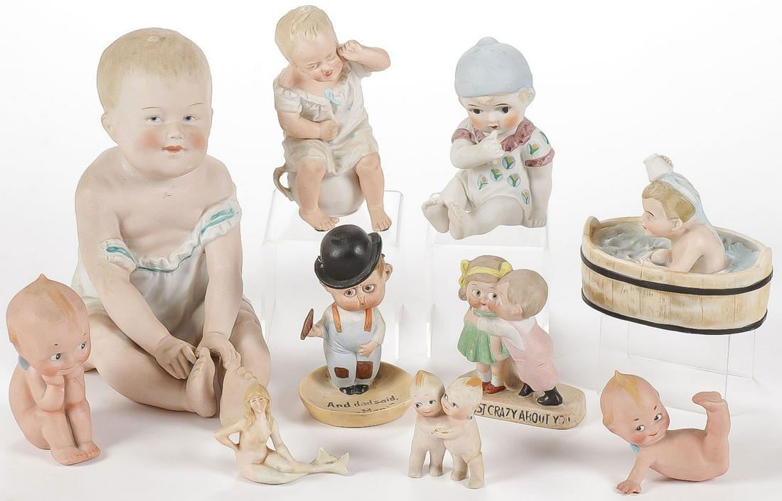 GERMAN BISQUE NOVELTIES C. 1900: GERMAN BISQUE NOVELTIES C. 1900. Comprising a large bisque piano baby with indistinguishable impressed mark on verso and repaired head, a constipated crying baby on a chamber pot, a big-eyed girl made