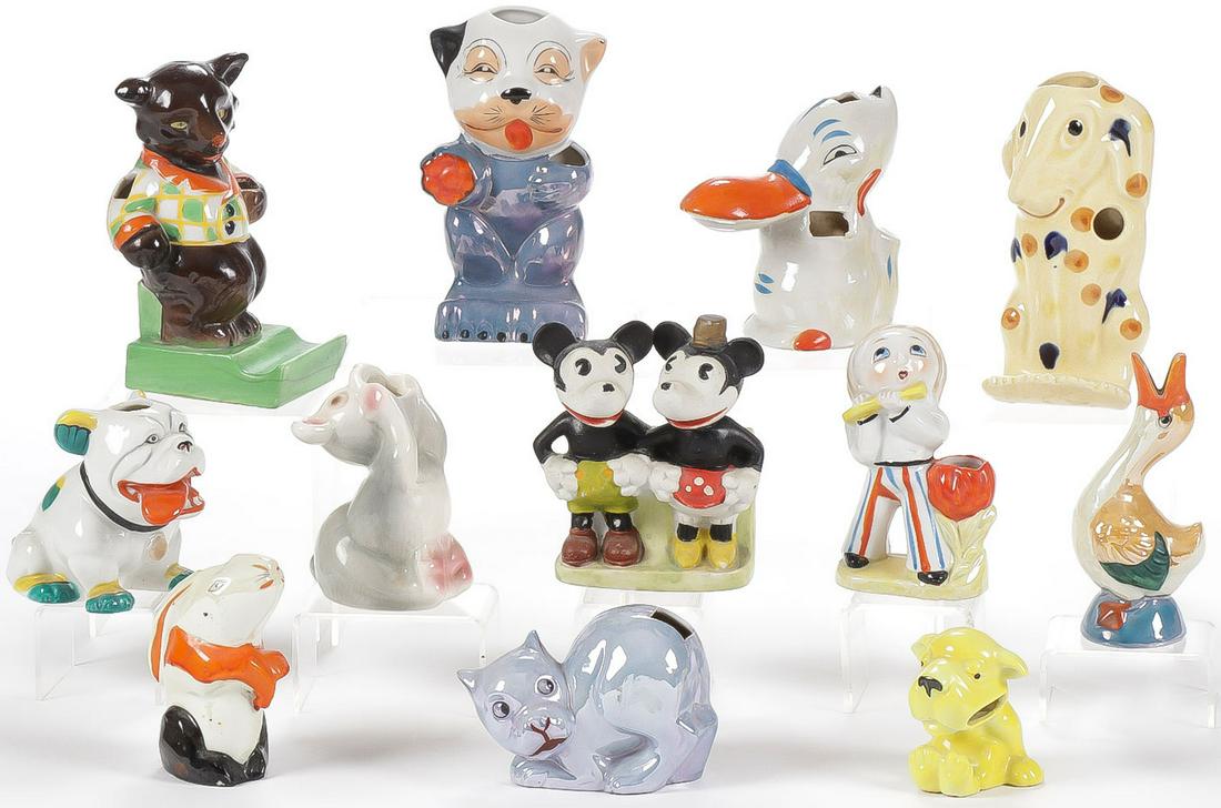22 VINTAGE TOOTHBRUSH HOLDERS: 22 VINTAGE TOOTHBRUSH HOLDERS. Comprising 22 porcelain mostly Japanese figural toothbrush holders circa 1925-1940, including Micky and Minnie Mouse, Uncle Walt and Skeezix. A good variety including ma