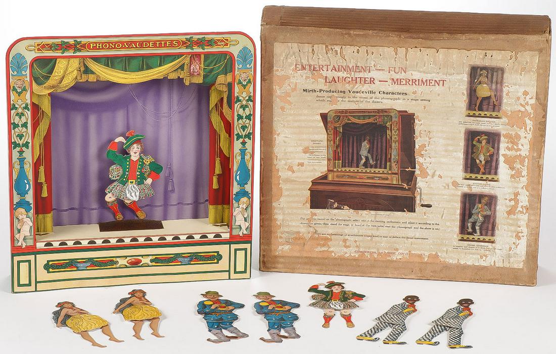 RARE PHONO VAUDETTES: RARE PHONO VAUDETTES. Comprising an interesting original in the box phonograph accompanying toy depicting a Scottish lassie, a shuffling Sambo, a Hawaiian dancer and a tramp comedian. Upright phonogra