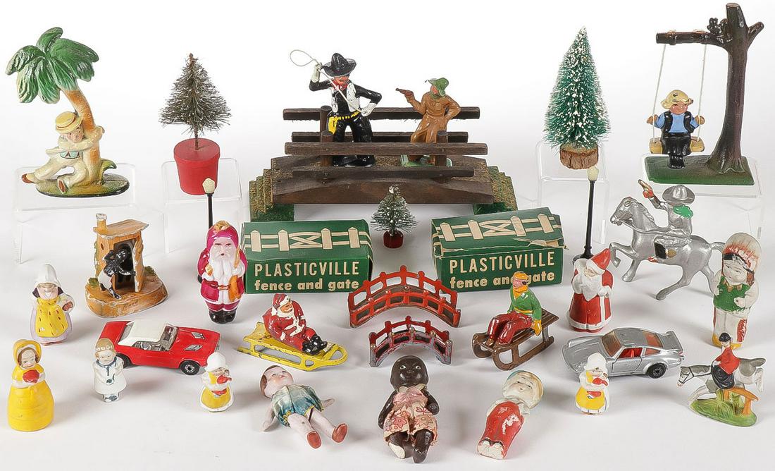 UNIQUE NOVELTY AND TOY SET: UNIQUE NOVELTY AND TOY SET. Comprising over 30 individual pieces. Including a bisque figure of two African Americans in an outhouse, a cast iron novelty swing, and a cast iron novelty figure of a drun