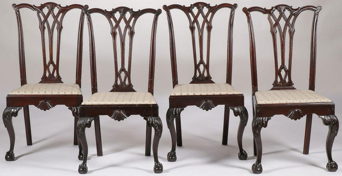 4 FINELY CARVED CHIPPENDALE CHAIRS 19TH C: FOUR CHIPPENDALE CHAIRS 19TH C. Comprising four matching chairs with ornately carved backs set above upholstered seats giving way to two front cabriole legs terminating in ball feet. Height 40 inches.