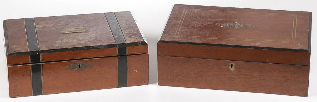 PAIR OF 19TH CENTURY LAP DESKS: PAIR OF 19TH CENTURY LAP DESKS. Each with fold out slanted felt-covered writing surface and various cubby holes for storage. One with black banding and beveled edge, the other with gilt decorated hing