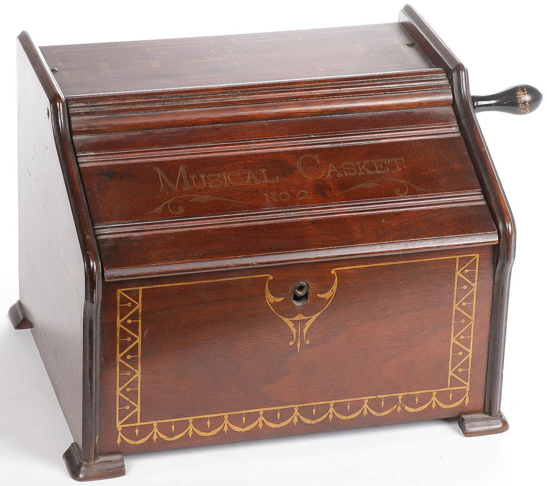 CLASSIC VICTORIAN ROLLER ORGAN: CLASSIC VICTORIAN ROLLER ORGAN. Beautiful walnut case with gilt pinstriping, inscribed Musical Casket No. 2, together with 8 rolls. SHIPPING NOTICE: Jackson's is your sole and only source for one stop