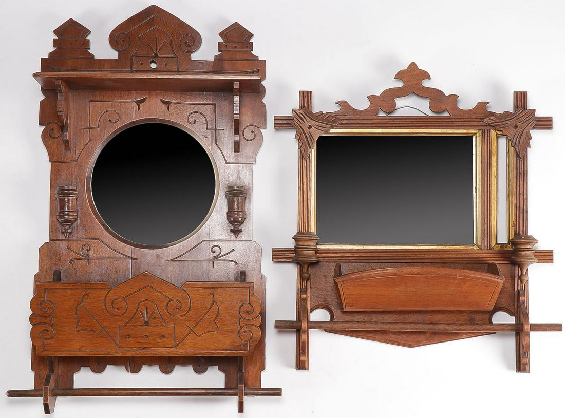 PR WALNUT VICTORIAN WALL POCKETS: PR WALNUT VICTORIAN WALL POCKETS. Comprising a pair of ornate Victorian wall pockets, or shaving mirrors, both with integral candle holders and towel bars beneath open pockets. Greatest height 23 inch