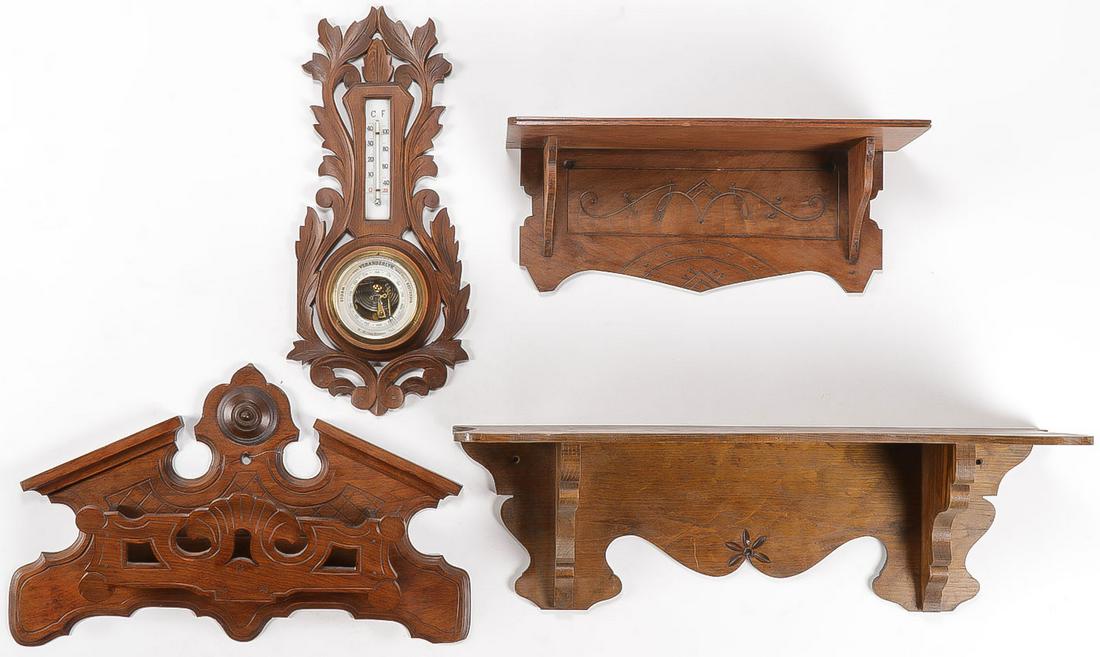 FOUR VICTORIAN WALNUT WALL MOUNTS: FOUR VICTORIAN WALNUT WALL MOUNTS. Comprising two shelves, one pocket, and a carved barometer thermometer, some repairs and losses. Greatest measurement (with shelf) 24 inches.SHIPPING NOTICE:Jackso