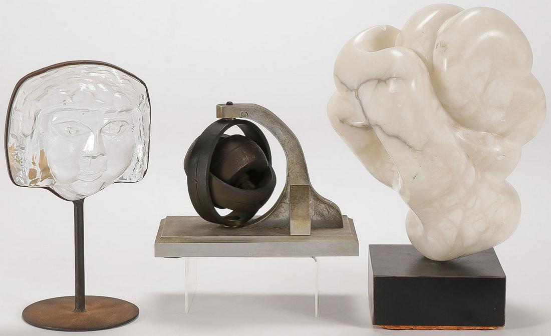 THREE MODERNIST SCULPTURES: THREE MODERNIST SCULPTURES. Comprising three individual modernist sculptures including a cast glass face on iron stand by Swedish artist Erik Hoglund (1932-1998). Height 10 inches (25.5 cm). together 
