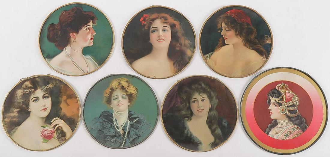 SEVEN VINTAGE FLUE COVERS: SEVEN VINTAGE FLUE COVERS. Comprising seven individual flue covers, each depicting a portrait of a beauty, most with original suspension chains, and one marked on verso "Made in Belgium". Average diam