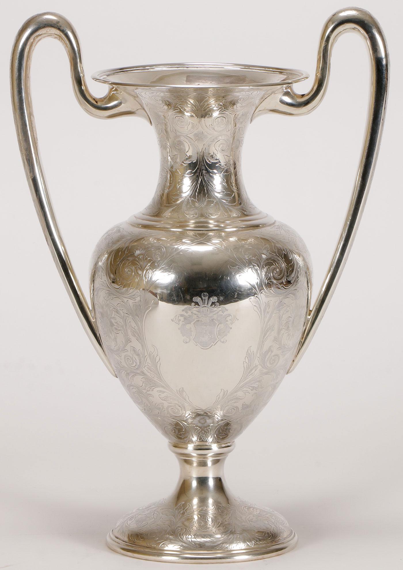 AMERICAN STERLING TROPHY CUP C. 1890: AMERICAN STERLING TROPHY CUP C. 1890. Comprising a large and impressive engraved sterling silver trophy cup, Davis & Galt Philadelphia. Of baluster form, the body overall engraved with scrolling folia