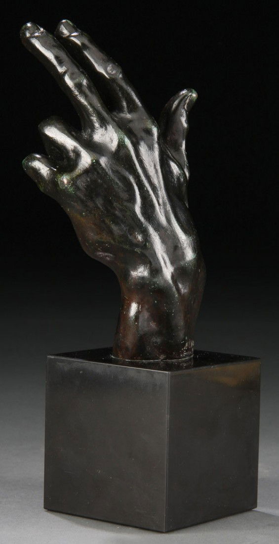 BRONZE, AUGUSTE RODIN LEFT HAND: AUGUSTE RODIN (French 1840-1917) Left Hand Bronze with brown and green patina Signed A. Rodin and inscribed Alexis Rudier Fondeur Paris Total height 7.5 inches, mounted on original black Belgium marbl