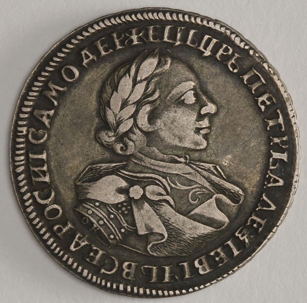A RUSSIAN PETER I RUBLE, 1720. : A RUSSIAN PETER I RUBLE, 1720. Variety with OK on sleeve. Bust right/crowned Imperial eagle, Kadashevsky mint. No shoulder pads, the rosette on the shoulder, Arabesques on his chest. G-VG.