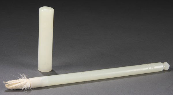 CHINESE CARVED WHITE JADE CALLIGRAPHY BRUSH, QING: A GOOD CHINESE CARVED WHITE JADE CALLIGRAPHY BRUSH AND COVER, QING DYNASTY. In an even-toned white jade of elongated cylindrical form with carved flower bud finial and incised scroll band terminating 