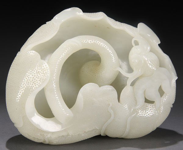 CHINESE CARVED WHITE JADE BRUSH WASHER QING: A FINE CHINESE CARVED WHITE JADE FIGURAL BRUSH WASHER, QING DYNASTY. In the form of a semi-closed lotus blossom with goldfish, the exterior well carved and detailed in an even toned translucent white